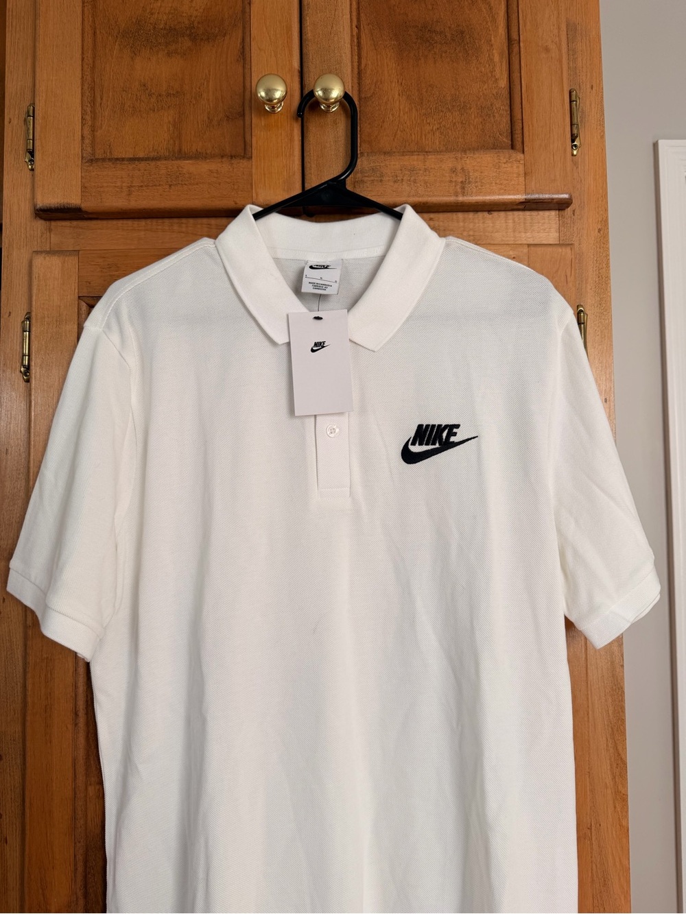 Nike White Polo with Black Swoosh Logo
